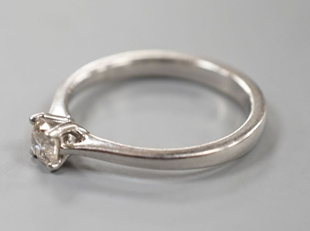 A modern platinum and solitaire diamond ring, size Q/R, gross weight 5.4 grams